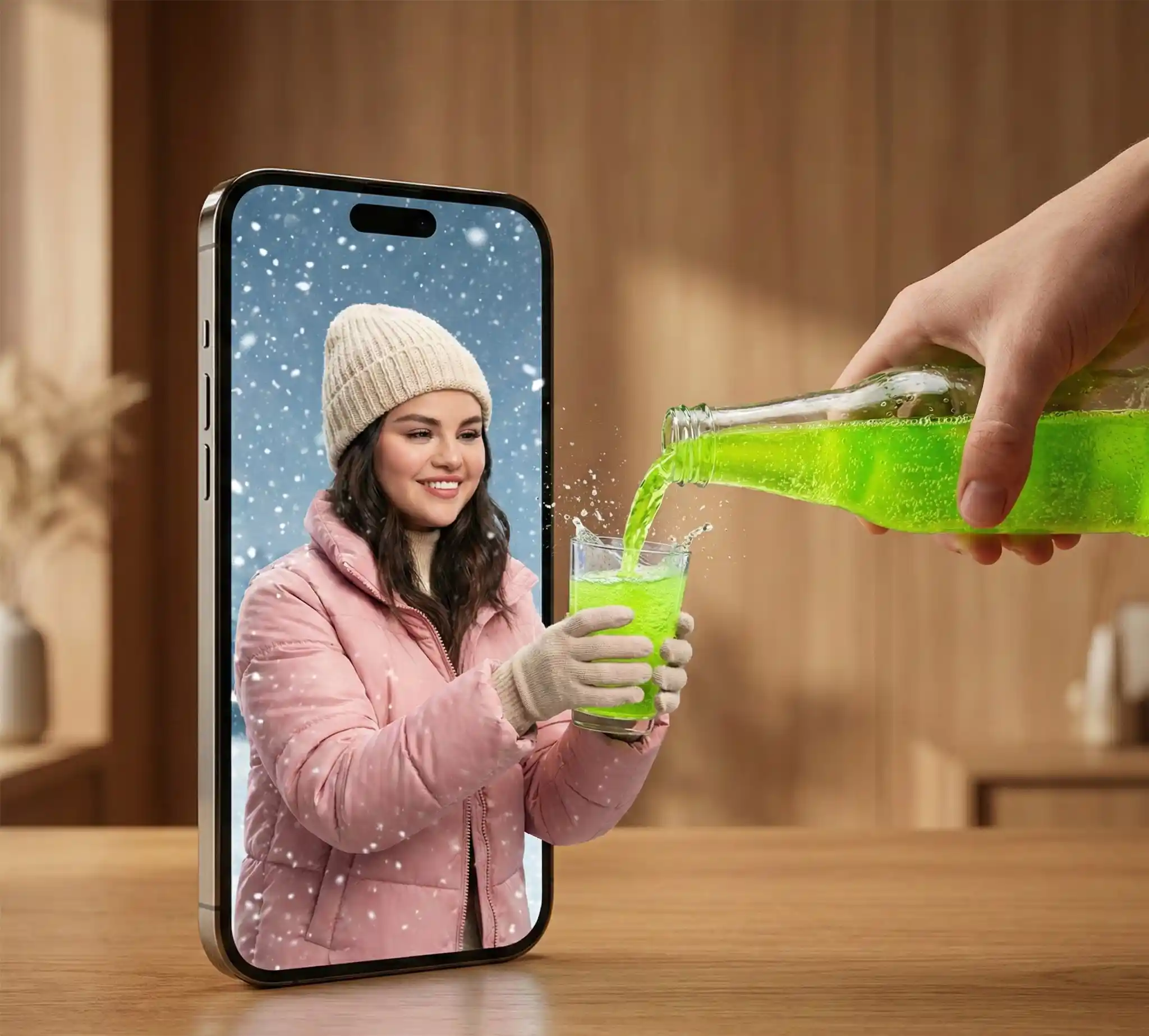 trend prompt: A hyper-realistic surreal photograph of a modern smartphone lying flat on a wooden table, its screen acting as a portal between two worlds. From inside the phone screen, a smiling young man dressed in winter clothing—puffer jacket, knit beanie, gloves—extends his hands outward into the real world, holding a clear glass. From outside the phone, a real human hand pours a bright neon-green carbonated drink into the glass, with liquid splashes frozen mid-air as it crosses the boundary between the digital screen and reality. Snowflakes drift inside the phone screen while the real environment remains warm and minimal. Gemini Ultra-detailed textures, cinematic lighting, shallow depth of field, photorealistic surrealism, high-resolution editorial photography.